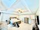 Spacious bedroom featuring neutral decor, a tray ceiling with ceiling fan, and an ensuite bathroom at 4476 River Rd, Stanfield, NC 28163
