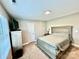 Neutral bedroom features carpeted floor, tv, dresser and furnishings at 4476 River Rd, Stanfield, NC 28163