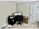 Bright bedroom offers a functional office space, door to hallway, and soft carpet for a serene atmosphere at 4476 River Rd, Stanfield, NC 28163