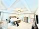 Spacious bedroom featuring neutral decor, a tray ceiling with ceiling fan, and an ensuite bathroom at 4476 River Rd, Stanfield, NC 28163