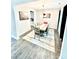 Dining room features hardwood floors, modern decor, and an open layout at 4476 River Rd, Stanfield, NC 28163