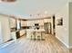 Modern kitchen features stainless appliances, granite countertops, kitchen island with seating, and hardwood floors at 4476 River Rd, Stanfield, NC 28163
