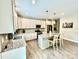 Bright, modern kitchen with stainless steel appliances, granite countertops, and a center island with seating at 4476 River Rd, Stanfield, NC 28163