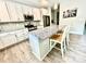 Modern kitchen with stainless appliances, granite countertops, and an island with seating at 4476 River Rd, Stanfield, NC 28163