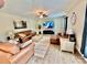 Inviting living room with comfortable leather seating, a ceiling fan, and a modern TV at 4476 River Rd, Stanfield, NC 28163