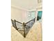 A staircase with iron railings and carpeted steps leading to the upper level at 4476 River Rd, Stanfield, NC 28163