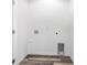 Empty laundry room with gray vinyl flooring and white walls ready for appliances at 538 Williamson St, Charlotte, NC 28208