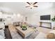 Large, open-concept living area with stylish decor, modern furnishings, and seamless kitchen access at 538 Williamson St, Charlotte, NC 28208
