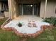 Charming backyard patio with white gravel landscaping and stone walkway, great for relaxing outdoors at 58 Ridgeport Rd, Clover, SC 29710