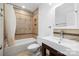 Bathroom features a tiled shower-tub combo with a shower curtain and sleek single sink vanity at 58 Ridgeport Rd, Clover, SC 29710