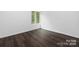 Bright bedroom with a large window and dark hardwood floors at 58 Ridgeport Rd, Clover, SC 29710