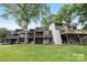 Multi-story condo building featuring multiple balconies and a grassy lawn at 58 Ridgeport Rd, Clover, SC 29710