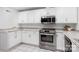 A modern kitchen with stainless steel appliances, white cabinets and light countertops at 58 Ridgeport Rd, Clover, SC 29710