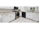 Updated kitchen featuring white cabinets, stainless steel appliances, and a tile floor at 58 Ridgeport Rd, Clover, SC 29710