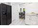 Bright kitchen featuring white cabinets, stainless steel appliances and a refrigerator at 58 Ridgeport Rd, Clover, SC 29710