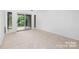 Living room featuring a sliding glass door to the outside area and carpet floor at 58 Ridgeport Rd, Clover, SC 29710
