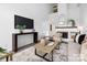 Bright living room features a fireplace, modern furnishings, and neutral tones at 58 Ridgeport Rd, Clover, SC 29710