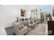 Open-concept living area featuring high ceilings, natural light, and stylish decor at 58 Ridgeport Rd, Clover, SC 29710