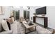 Airy living room with large windows, modern decor, and sliding glass doors to the balcony at 58 Ridgeport Rd, Clover, SC 29710