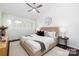 Bright main bedroom featuring a ceiling fan, neutral decor, and natural light from the windows at 58 Ridgeport Rd, Clover, SC 29710