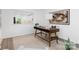 Home office with a view to the kitchen, complemented by a contemporary desk and a stylish area rug at 58 Ridgeport Rd, Clover, SC 29710