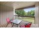 Outdoor patio with a table and chairs with a view of the lake at 58 Ridgeport Rd, Clover, SC 29710