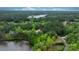 Panoramic aerial view of a wooded neighborhood featuring a beautiful lake at 6265 Riviera Run Estates Dr, Hickory, NC 28601