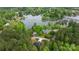 Breathtaking aerial view of a home surrounded by lush greenery near a tranquil lake at 6265 Riviera Run Estates Dr, Hickory, NC 28601