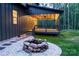 A view of the back of the house, highlighting the beautiful deck, landscape and outdoor fire pit at 6265 Riviera Run Estates Dr, Hickory, NC 28601
