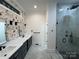 Beautiful bathroom features a double sink vanity, quartz countertops, and tile floors at 6265 Riviera Run Estates Dr, Hickory, NC 28601
