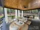Relaxing covered patio with comfortable seating and an outdoor dining area, perfect for entertaining and enjoying nature at 6265 Riviera Run Estates Dr, Hickory, NC 28601