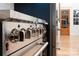 Close up of a stainless steel range and hood, showcasing the modern appliances in this stylish kitchen at 6265 Riviera Run Estates Dr, Hickory, NC 28601
