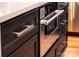 Modern kitchen features stainless steel appliances and black cabinets at 6265 Riviera Run Estates Dr, Hickory, NC 28601