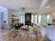 Spacious living room featuring hardwood floors, a cozy fireplace, and ample natural light at 6265 Riviera Run Estates Dr, Hickory, NC 28601