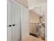 Hallway with chandelier lighting and carpet leading into home with carpeted stairs at 703 Sainte Rose Ln, Charlotte, NC 28226