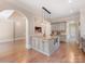 Kitchen with island, stone countertops, and stainless steel appliances at 703 Sainte Rose Ln, Charlotte, NC 28226