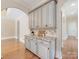 Kitchen area featuring granite countertops, wood cabinets, and view of another room at 703 Sainte Rose Ln, Charlotte, NC 28226