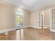 Inviting home office with hardwood floors, natural light, and french doors at 703 Sainte Rose Ln, Charlotte, NC 28226