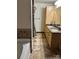 Bathroom features a double sink vanity, framed mirrors and tile flooring at 715 N Church St # 613, Charlotte, NC 28202
