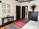 Bedroom featuring an ornate decorative headboard, wood floors, and designer lighting at 715 N Church St # 613, Charlotte, NC 28202