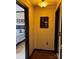 Hallway leads into a bedroom with a black bed frame and light blue bedding at 715 N Church St # 613, Charlotte, NC 28202