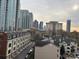 Elevated view of the city skyline and rooftops of condominiums on a cloudy day at 715 N Church St # 613, Charlotte, NC 28202