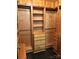 Walk-in closet featuring custom wooden shelving, drawers, and hanging rods at 715 N Church St # 613, Charlotte, NC 28202