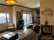 Open concept living room with modern furnishings and a balcony, creating a bright and airy space at 715 N Church St # 613, Charlotte, NC 28202