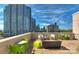 Modern outdoor patio area featuring contemporary furniture and city views at 715 N Church St # 613, Charlotte, NC 28202