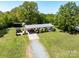 Aerial view of a single-story home on a large lot, including a gazebo and outbuildings at 7617 Pleasant Hill Church Rd, Marshville, NC 28103