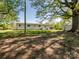 Large backyard with mature trees, utility building, and room to roam at 7617 Pleasant Hill Church Rd, Marshville, NC 28103