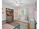 Bedroom with an open closet, wood floors, and pink accents at 7617 Pleasant Hill Church Rd, Marshville, NC 28103