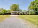 Charming single story home with a gravel driveway and carport at 7617 Pleasant Hill Church Rd, Marshville, NC 28103