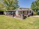 Charming single-story home with a covered porch, landscaped yard, and a gazebo for outdoor relaxation at 7617 Pleasant Hill Church Rd, Marshville, NC 28103